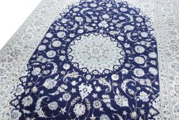 Backside of handmade New Nain rug showing knot structure and weave density