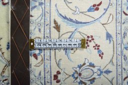 Backside of handmade 2000s Nain rug showing knot structure and weave density