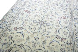 Backside of handmade New Nain rug showing knot structure and weave density