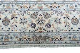 Corner detail of New Nain rug showing border pattern and Wool pile