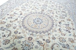 Backside of handmade New Nain rug showing knot structure and weave density
