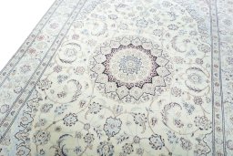Backside of handmade New Nain rug showing knot structure and weave density