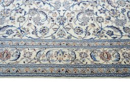 Corner detail of New Nain rug showing border pattern and Wool pile