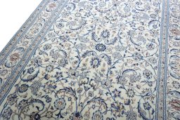 Backside of handmade New Nain rug showing knot structure and weave density