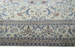 Corner detail of New Nain rug showing border pattern and Wool pile