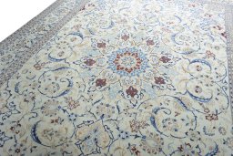 Backside of handmade New Nain rug showing knot structure and weave density