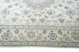 Corner detail of 2000s Nain rug showing border pattern and Wool pile