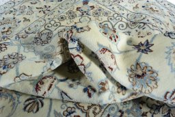Surface texture of 2000s Nain rug with natural Wool and intricate pattern