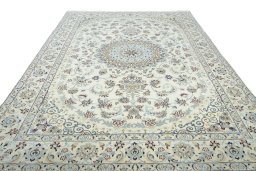 Surface texture of 2000s Nain rug with natural Wool and intricate pattern