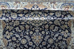 Close-up detail of 2000s Nain rug from Iran / Persia showing Cork weave