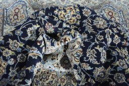 Surface texture of 2000s Nain rug with natural Cork and intricate pattern