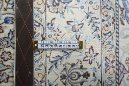 Backside of handmade 2000s Nain rug showing knot structure and weave density
