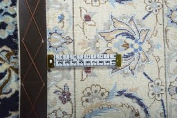 Backside of handmade New Nain rug showing knot structure and weave density