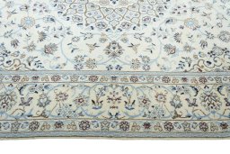 Corner detail of New Nain rug showing border pattern and Wool pile