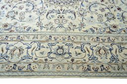 Corner detail of New Nain rug showing border pattern and Wool pile