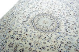 Backside of handmade New Nain rug showing knot structure and weave density