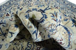 Surface texture of 2000s Nain rug with natural Wool and intricate pattern