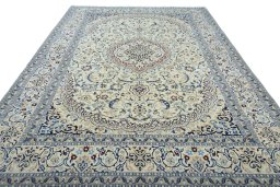 Surface texture of 2000s Nain rug with natural Wool and intricate pattern