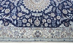 Corner detail of New Nain rug showing border pattern and Wool pile