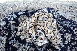 Surface texture of New Nain rug with natural Wool and intricate pattern