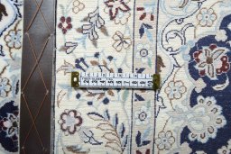 Backside of handmade New Nain rug showing knot structure and weave density