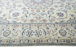 Corner detail of New Nain rug showing border pattern and Wool pile