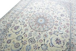 Backside of handmade New Nain rug showing knot structure and weave density