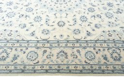Corner detail of New Nain rug showing border pattern and Wool pile