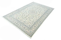 Corner detail of New Nain rug showing border pattern and Wool pile