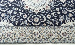 Corner detail of New Nain rug showing border pattern and Wool pile