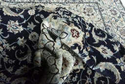 Surface texture of New Nain rug with natural Wool and intricate pattern