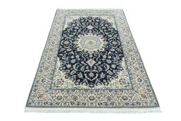 Surface texture of New Nain rug with natural Wool and intricate pattern
