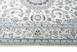 Corner detail of New Nain rug showing border pattern and Cork pile