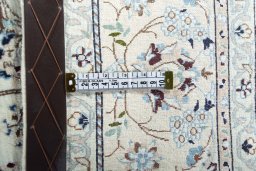 Backside of handmade New Nain rug showing knot structure and weave density