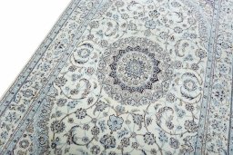 Backside of handmade New Nain rug showing knot structure and weave density