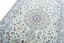 Backside of handmade New Nain rug showing knot structure and weave density