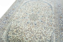 Backside of handmade New Nain rug showing knot structure and weave density