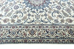 Corner detail of New Nain rug showing border pattern and Wool pile