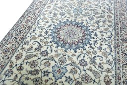 Backside of handmade New Nain rug showing knot structure and weave density
