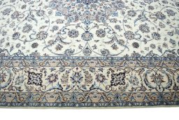 Corner detail of New Nain rug showing border pattern and Cork pile