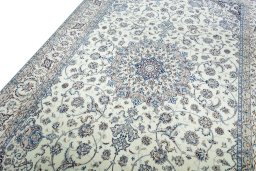 Backside of handmade New Nain rug showing knot structure and weave density