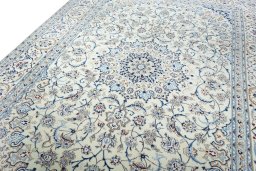 Backside of handmade New Nain rug showing knot structure and weave density