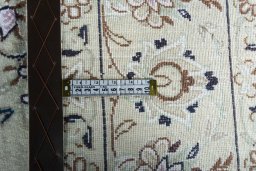 Backside of handmade New Nain rug showing knot structure and weave density