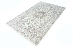 Corner detail of New Nain rug showing border pattern and Wool pile