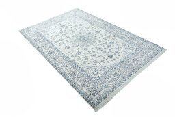 Backside of handmade New Nain rug showing knot structure and weave density