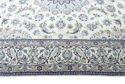 Corner detail of New Nain rug showing border pattern and Wool pile