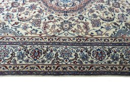 Corner detail of New Nain rug showing border pattern and Wool pile