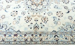 Corner detail of New Nain rug showing border pattern and Wool pile