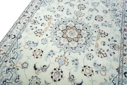 Backside of handmade New Nain rug showing knot structure and weave density