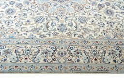 Corner detail of New Nain rug showing border pattern and Wool pile